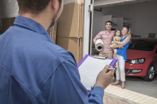 Staff member reviewing safety checks near storage units