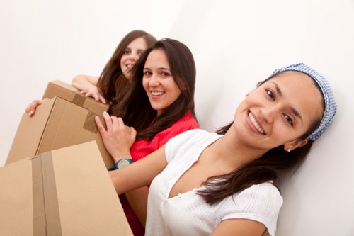 Packed boxes and furniture prepared for temporary storage in Putney